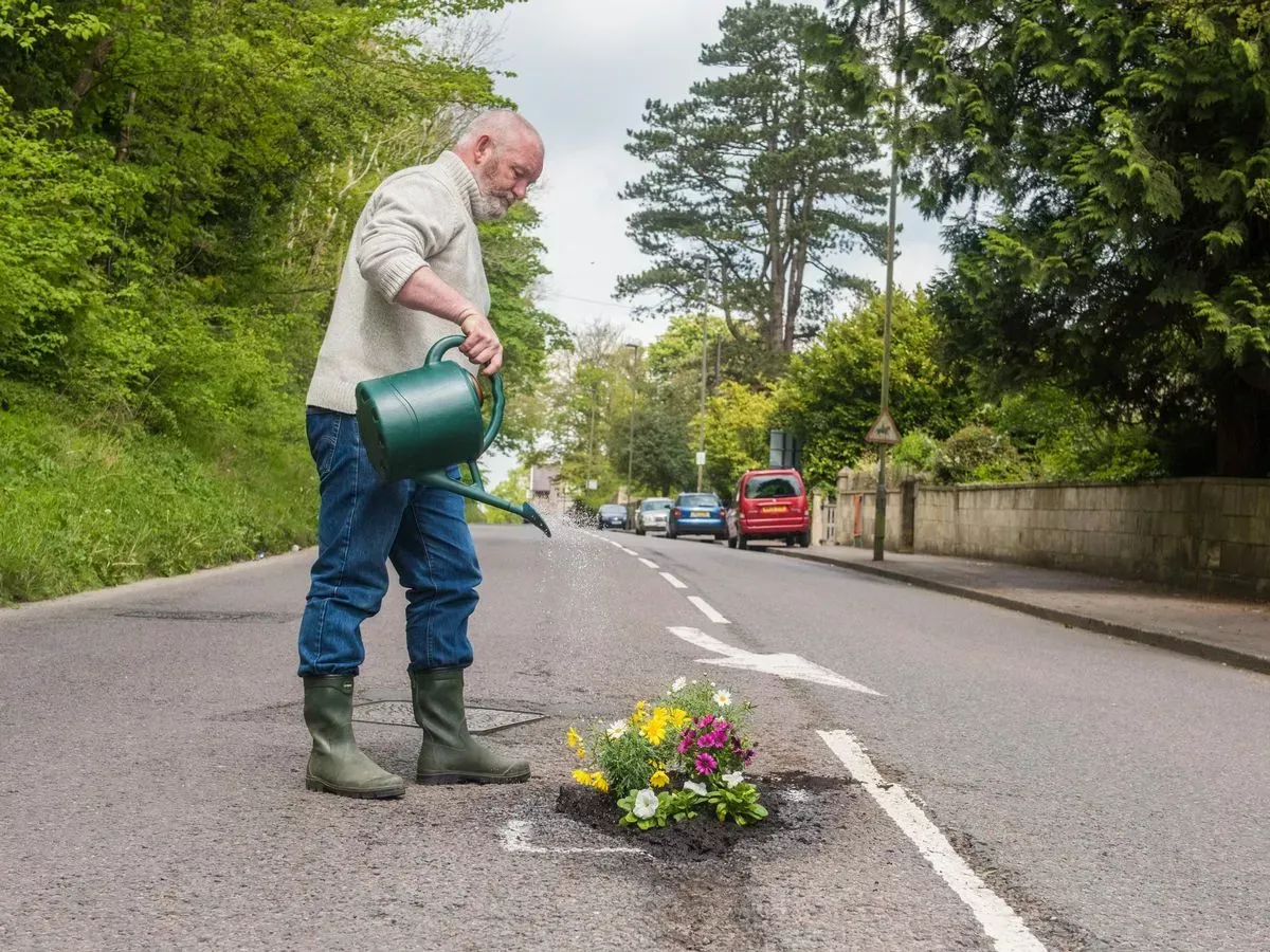 guerrilla-gardeners-floral-protest-prompts-pothole-repairs-in-west-sussex