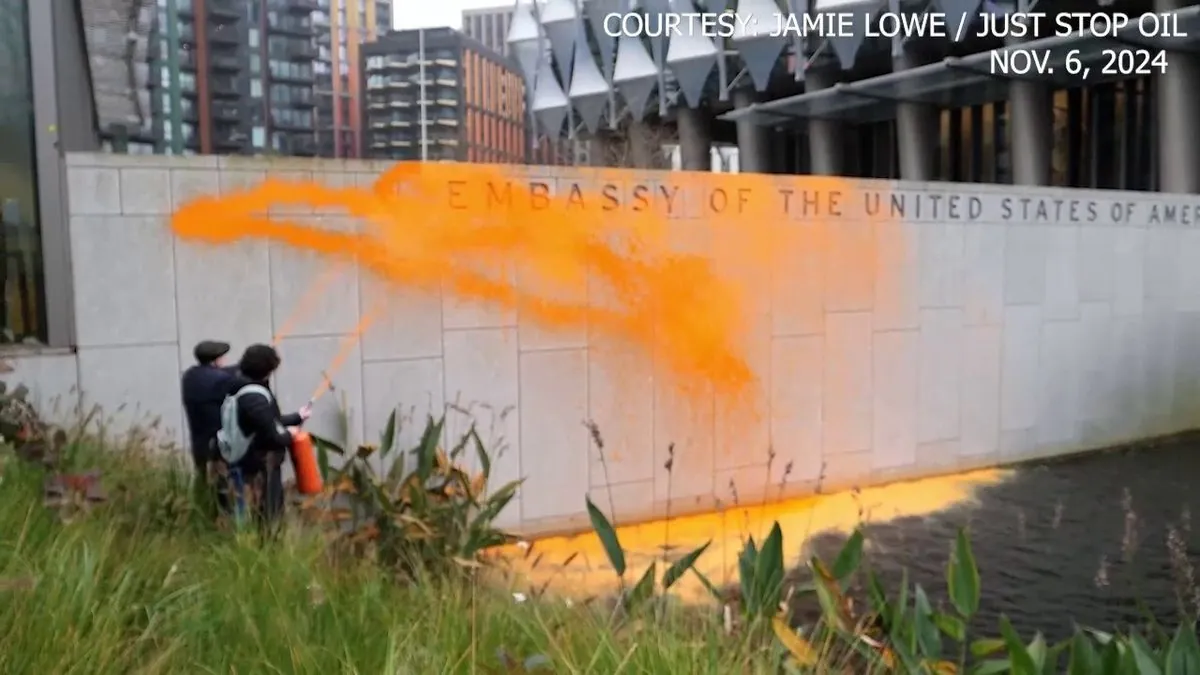 Two arrested after US embassy in London gets orange makeover from protesters