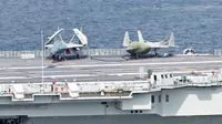 Chinese navy shows off new carrier jets in unprecedented drill